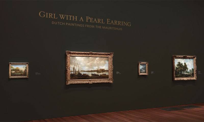 Photo from a museum exhibit in a gallery at the de Young Museum in San Fransciso. Captions on the walls describe the artwork, we supplied their custom wall transfers.