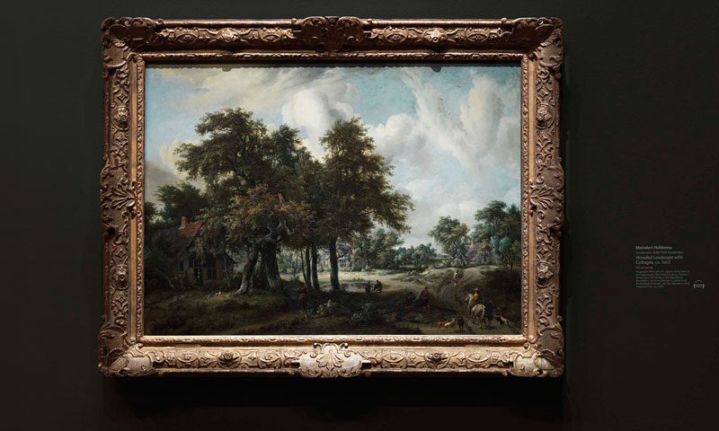 A dutch painting from the de Young Museum with a custom dry transfer on the wall beside the art piece used as a label or caption.