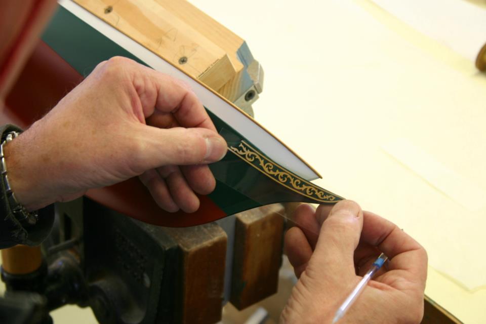 Applying rub down transfers on a scale model replica yacht by Classic Yacht Models