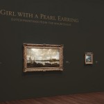 A view of the deYoung gallery in San Fransisco, the Girl with the Pearl Earring art exhibit using custom dry transfers on walls for captions and painting descriptions