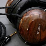 Lawton Audio custom made wood headphones, walnut finish with dry transfer logo rubbed down onto side earpiece. We make custom rubdown transfers for finished wood, like headphones, guitars and violins.