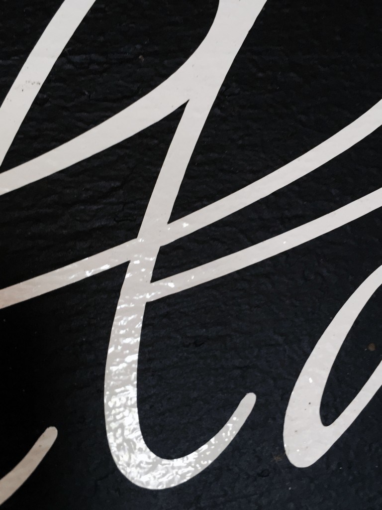 a closeup picture of vinyle lettering, bubbled
