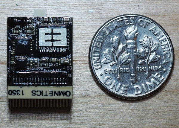 a white matter mircochip beside a dime for size comparison. Our custom decals for circuit boards are easily applied to any smooth plastic surface.