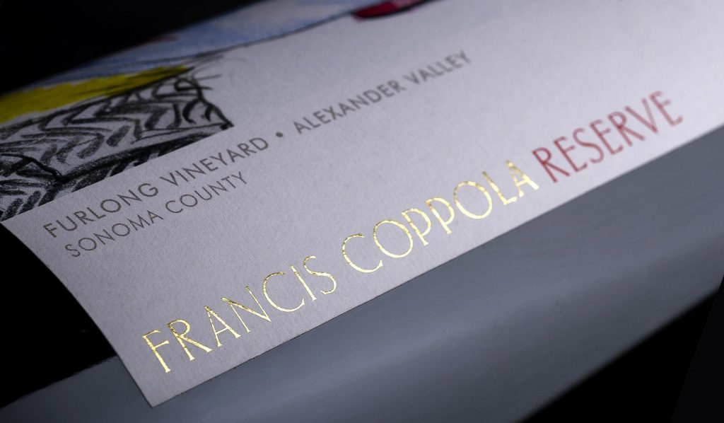 Closeup of dry transfer decal on glass wine bottle label for Francis Ford Coppola wines.