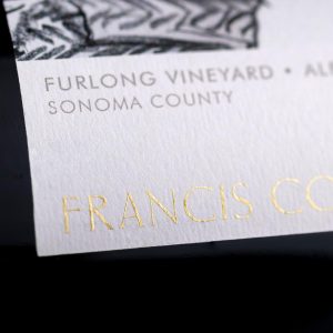 Closeup of dry transfer decal on glass wine bottle label for Francis Ford Coppola wines.