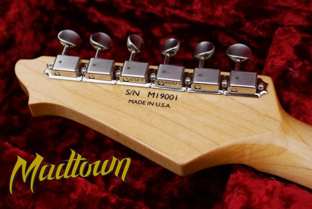 Custom transfer decal on a gutar head by Madtown guitars.