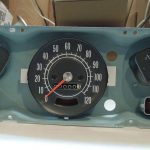 A vintage automobile dashboard with a dry transfer decal used to restore the speedometer and fuel gauge on a classic car. Classic car restoration decals.