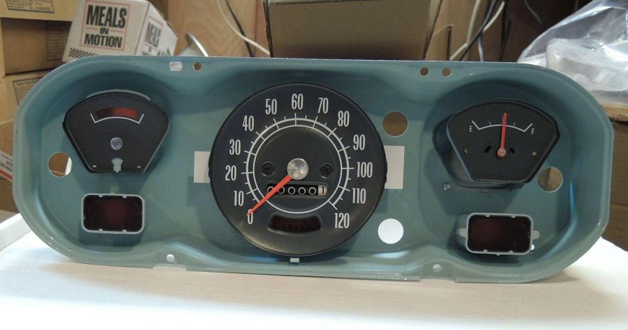 A vintage automobile dashboard with a dry transfer decal used to restore the speedometer and fuel gauge on a classic car. Classic car restoration decals.